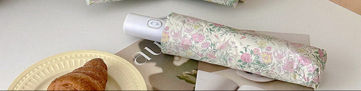 Women's folding umbrella with floral design and sturdy frame Bowlift