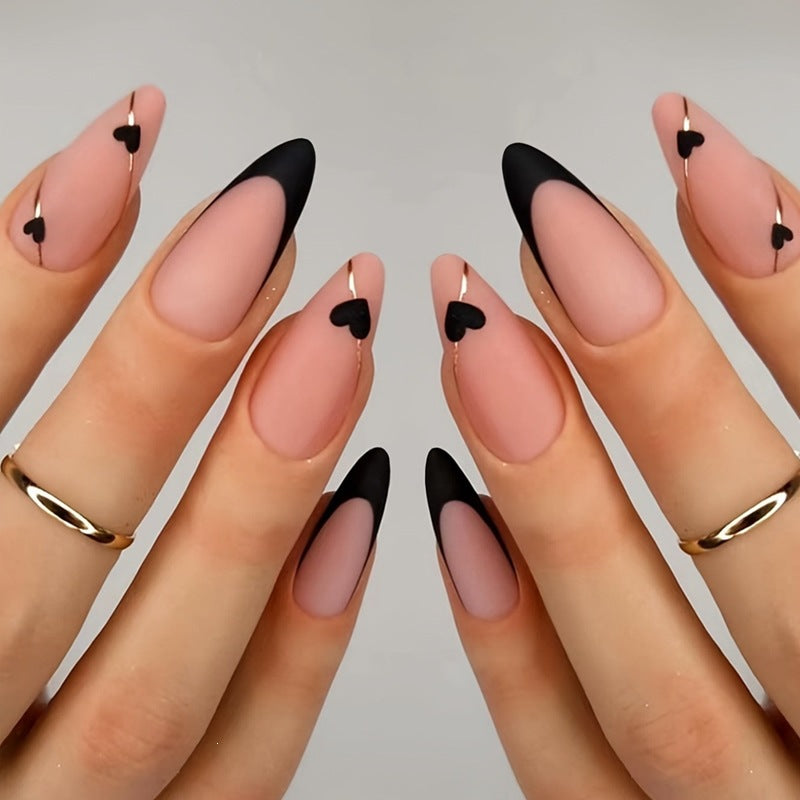 Creative nail art set with heart-shaped accents and elegant French tips Bowlift