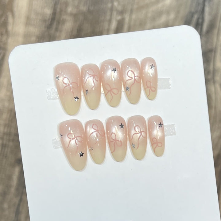 Elegant Stiletto Press-On Nail Set with Decorative Accents Bowlift