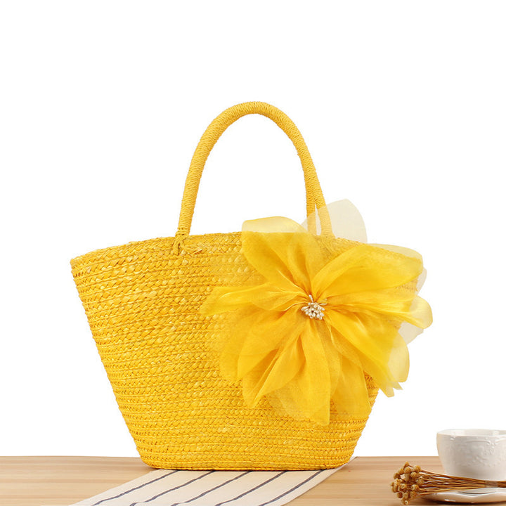Elegant straw bag with floral accents Bowlift