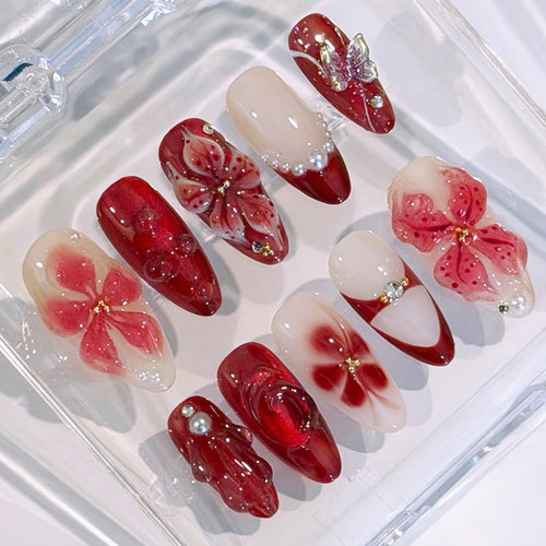 Artificial nail set with floral designs and glamorous accents Bowlift