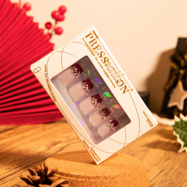 Artful nail extensions with glitter and jewelry embellishments Bowlift