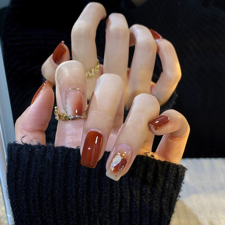 Elegant Glossy Press-On Nails with Gold Glitter Accents Bowlift