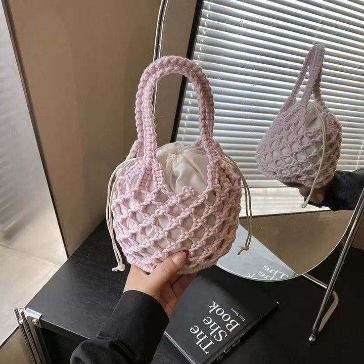 Fashionable handbag made of braided material Bowlift
