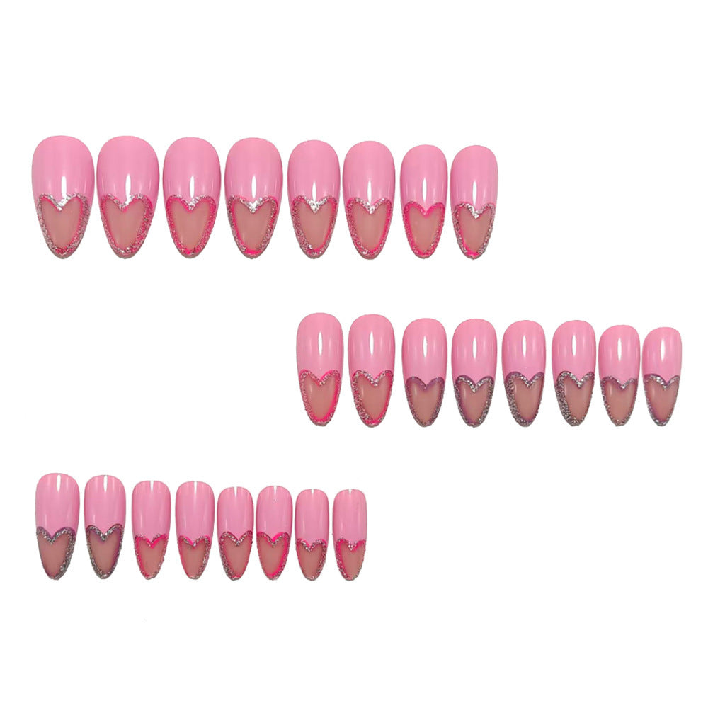 Art nails with heart design and glitter accents Bowlift
