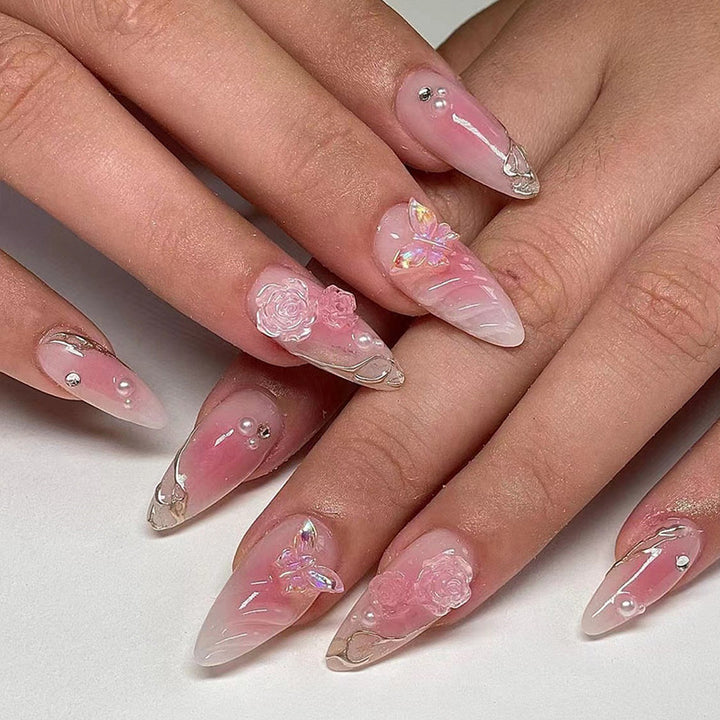 Artificial nails with delicate rose design and glitter accents Bowlift