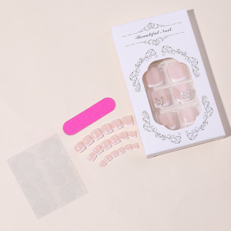 Artificial nail set with delicate decorations and glitter designs Bowlift