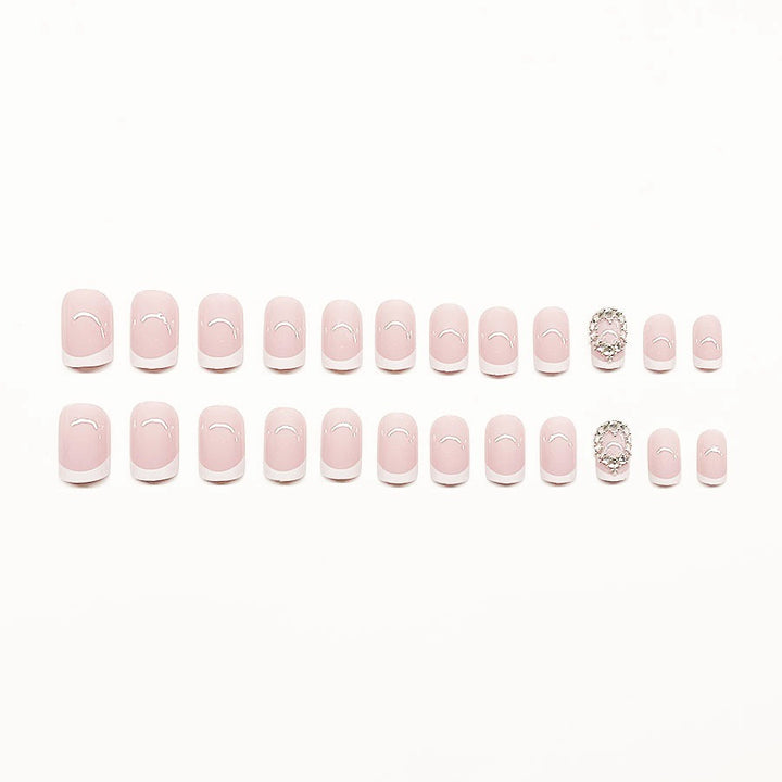 Artificial nail set with elegant French design and rhinestone embellishments Bowlift