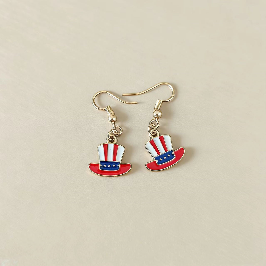 Women's handcrafted tassel earrings with flag medallion and pearl fringes Bowlift