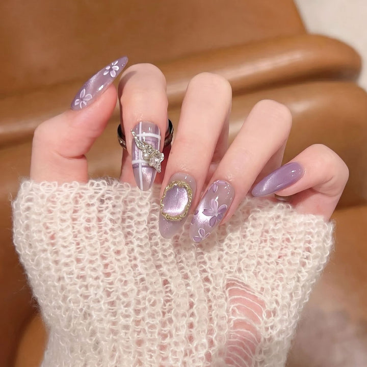 Artistic Press-On Nail Set with Floral Accents Bowlift