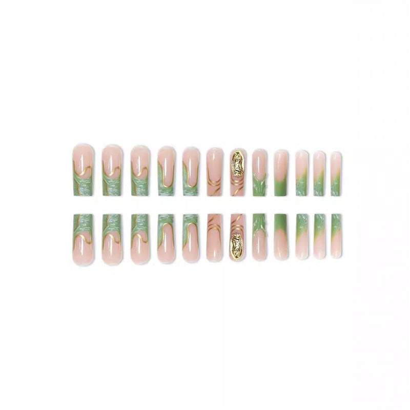 Artistic Press-On Nail Extensions with Gold Detailing Bowlift