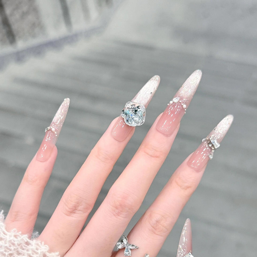 Artificial nails with glitter and crystal embellishments Bowlift