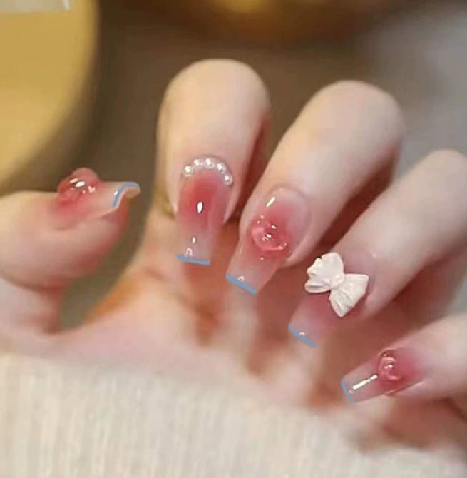 Elegant nail design with pearl embellishment Bowlift