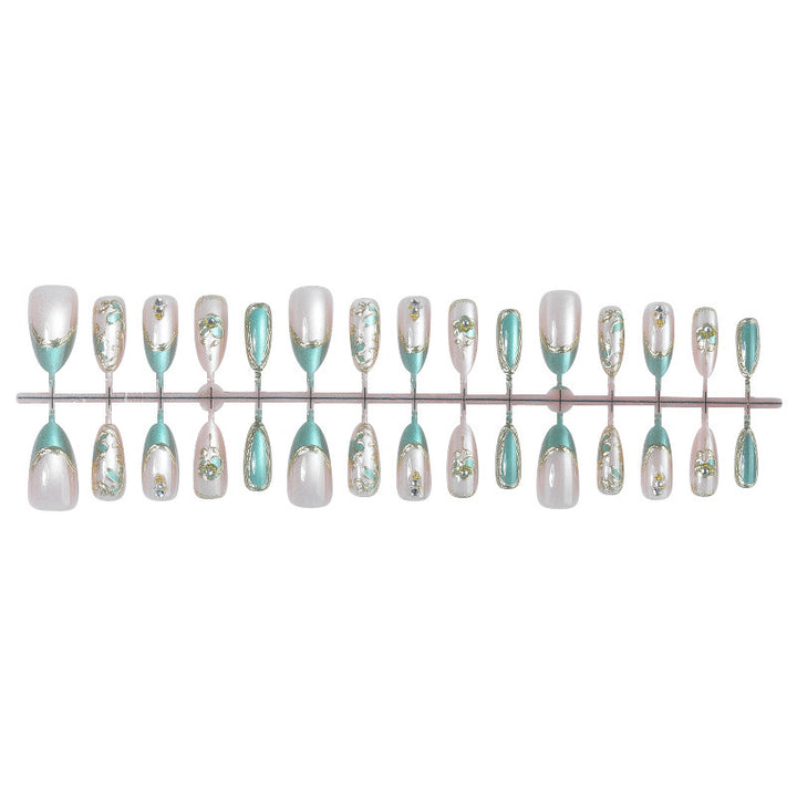 Artificial nail set with luxurious flower appliqués and glitter accents Bowlift