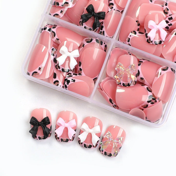 Artificial nail set with impressive floral and bow accents Bowlift