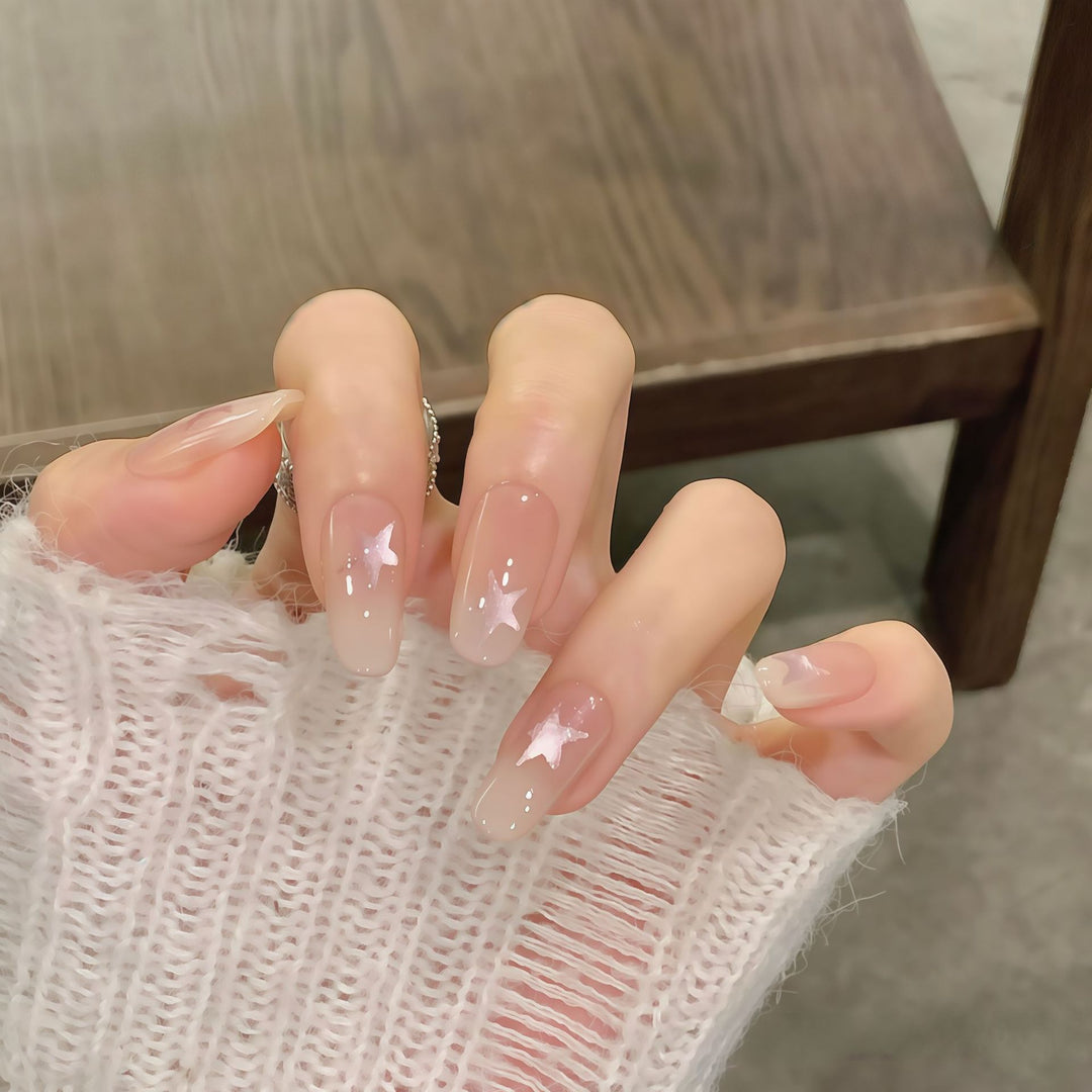 Artificial nails with sparkling stars and gentle gradient Bowlift