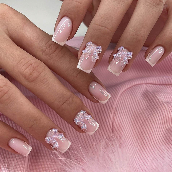 Acrylic nail set with elegant French tips and 3D details Bowlift