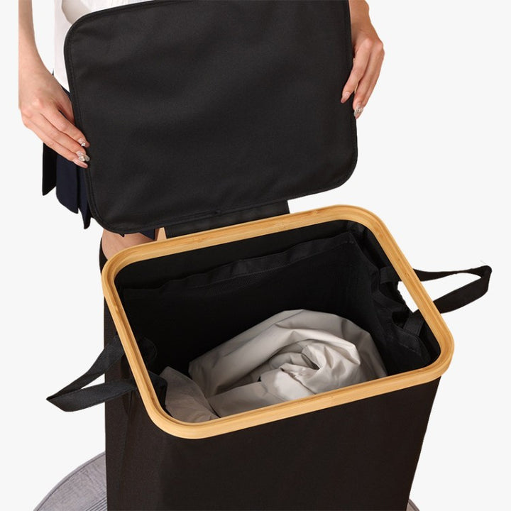 Elegant laundry container with practical lid and carrying system Bowlift