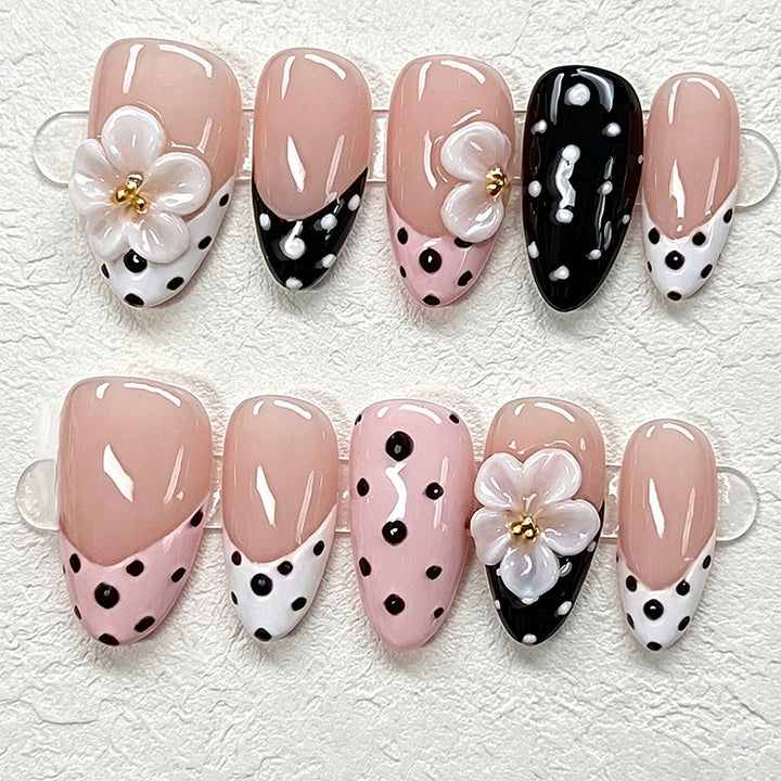 Nail art set with floral accents and elegant dots Bowlift