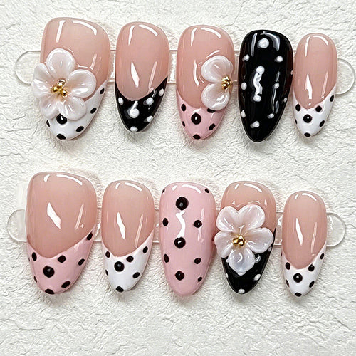Nail art set with floral accents and elegant dots Bowlift