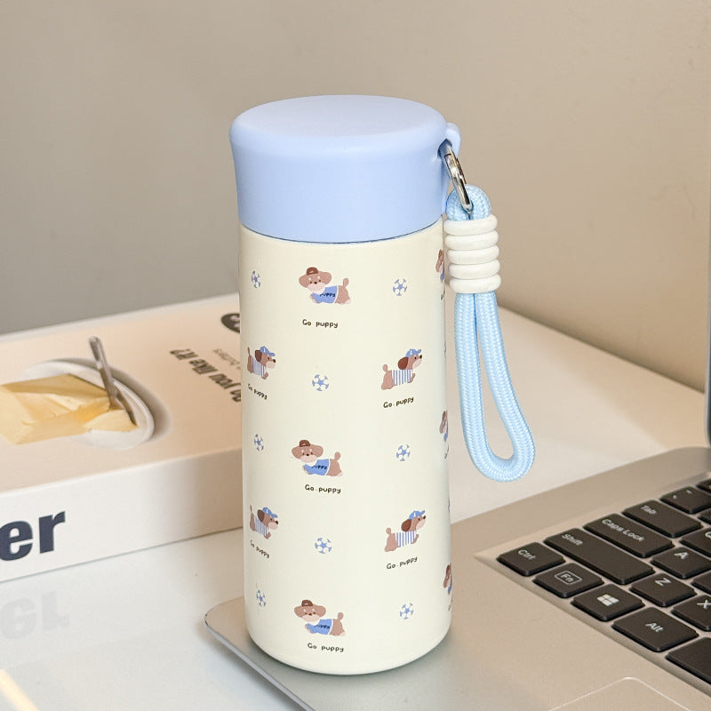 Women’s insulated drinking bottle with practical carrying strap and playful design Bowlift