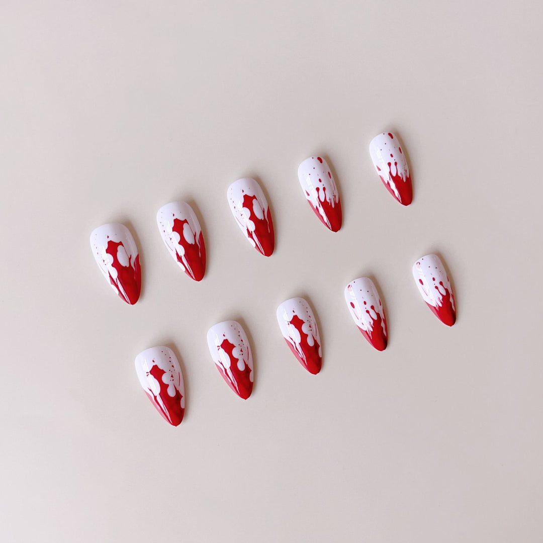 Artificial nail set with blood red inspired design and pointed accents Bowlift