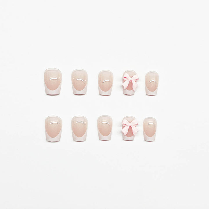 Decorative French Tip Nail Extensions with Bow Accents Bowlift