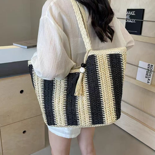 Beach bag with cheerful stripes and tassel details Bowlift
