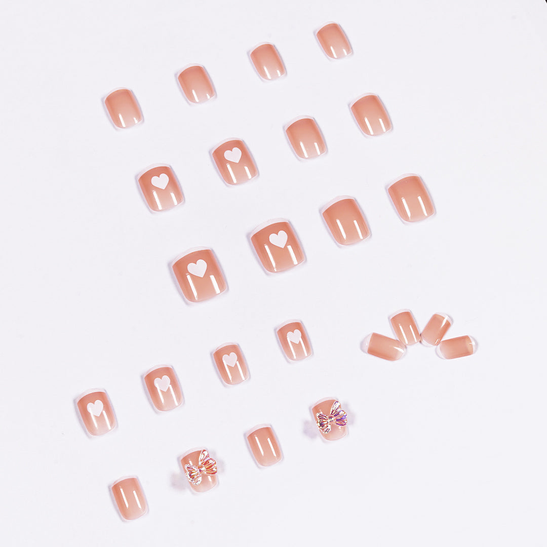 Nail art with heart and butterfly motifs Bowlift