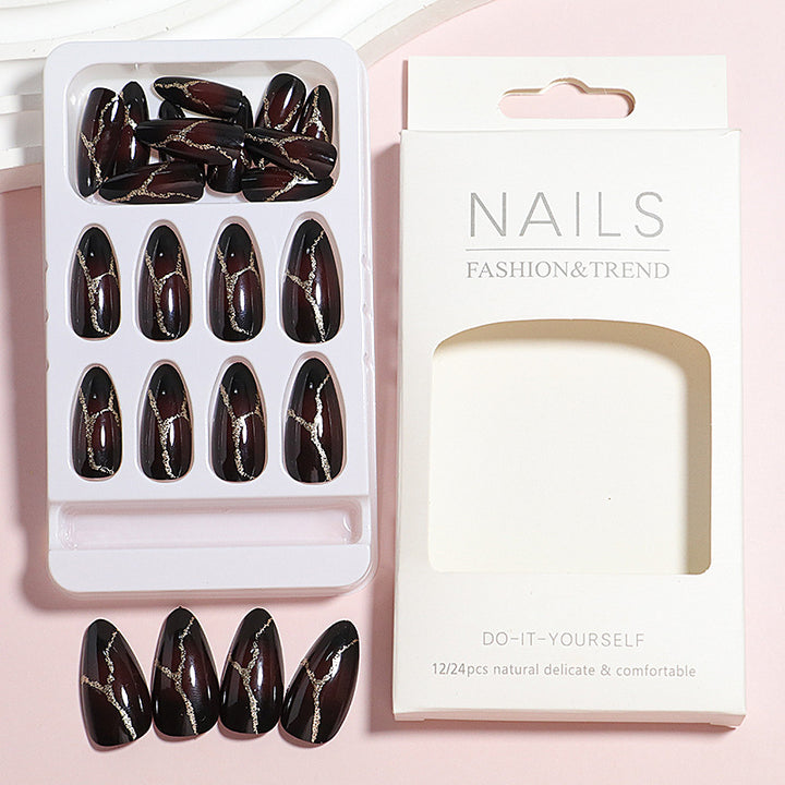 Artistic Press-On Nail Design with Gold Veining Accents Bowlift