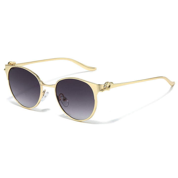 Elegant Cat-Eye Sunglasses with Decorative Gold Accents Bowlift