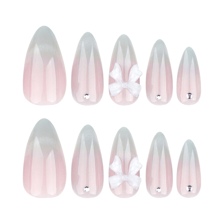 Elegant Stiletto Nails with Glitter and Bow Accents Bowlift