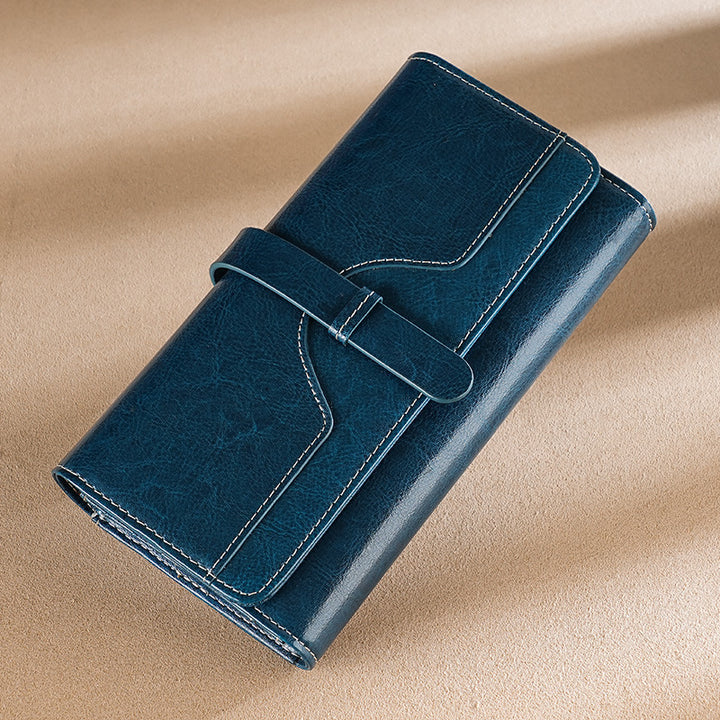 Premium leather long wallet clutch with strap closure and multiple card slots Bowlift