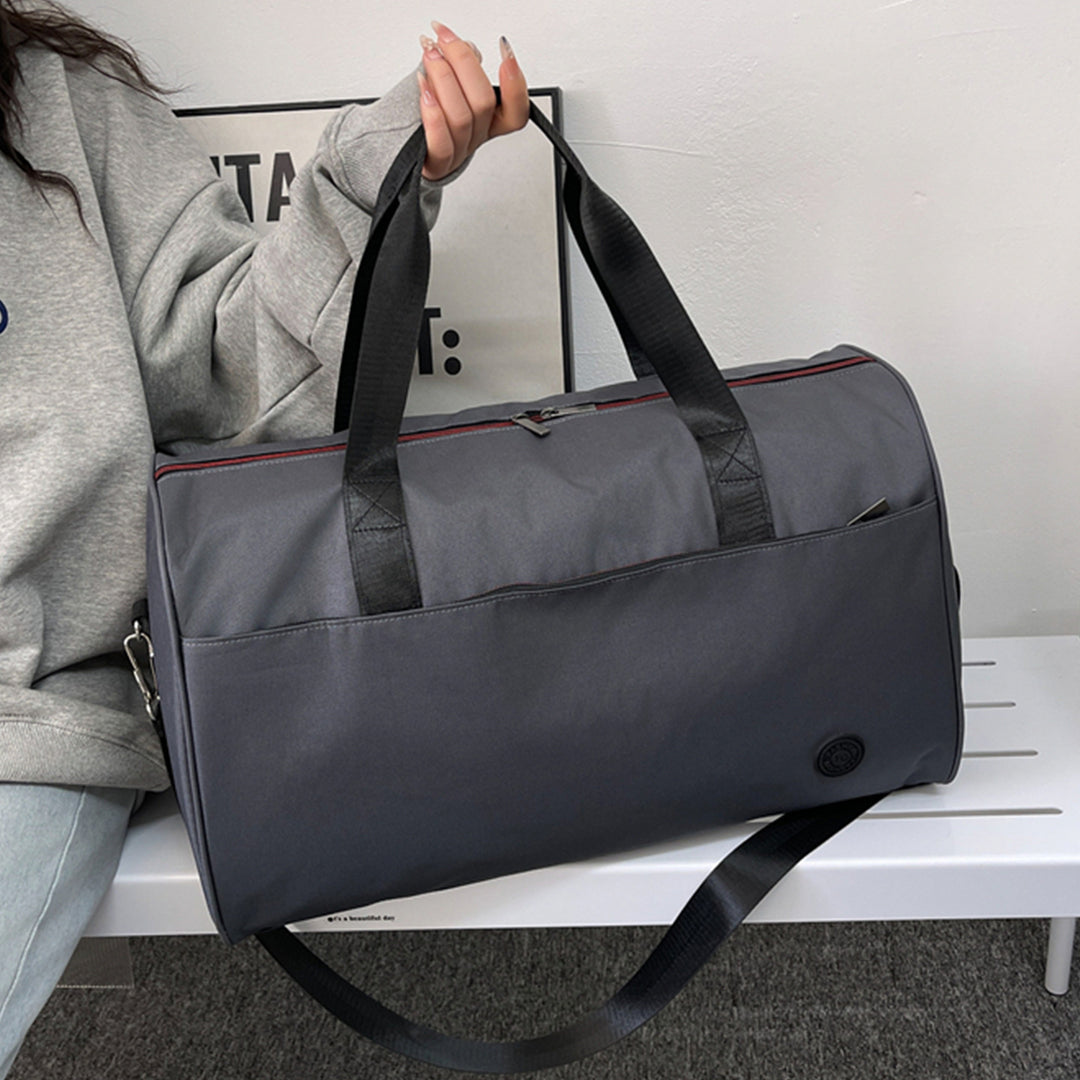 Sporty travel bag with sturdy carrying handles and removable shoulder strap Bowlift