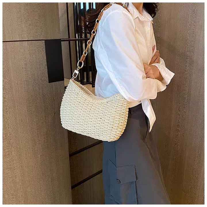 Handcrafted straw bag with golden chain details Bowlift