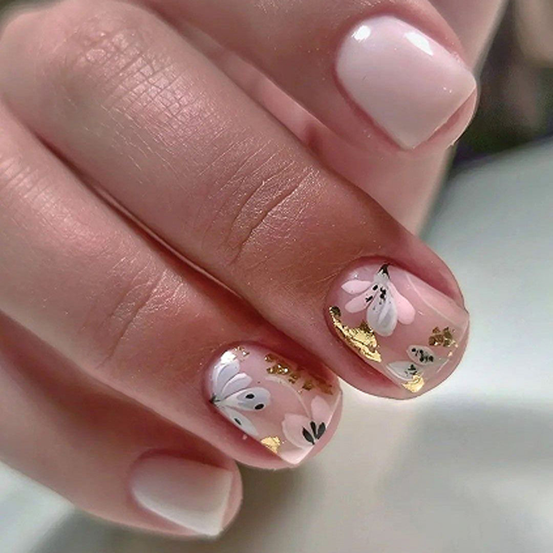 Elegant Artificial Nail Design with Floral Accents Bowlift