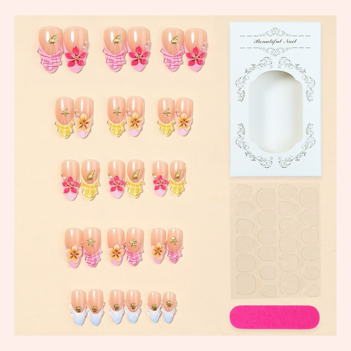 Artificial nail set with floral patterns and sparkling accents Bowlift