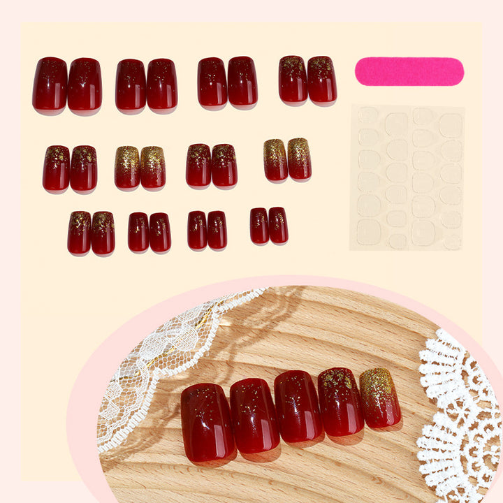 Elegant Press-On Nail Set with Glamorous Gold Glitter Accents Bowlift