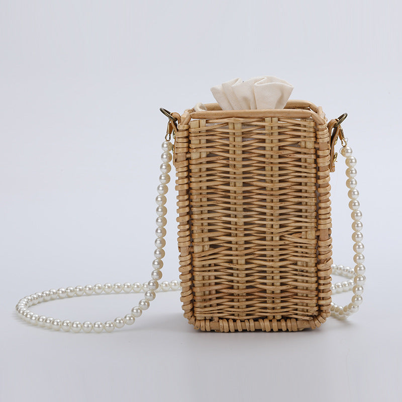 Women's handbag made of woven material with pearl accents Bowlift