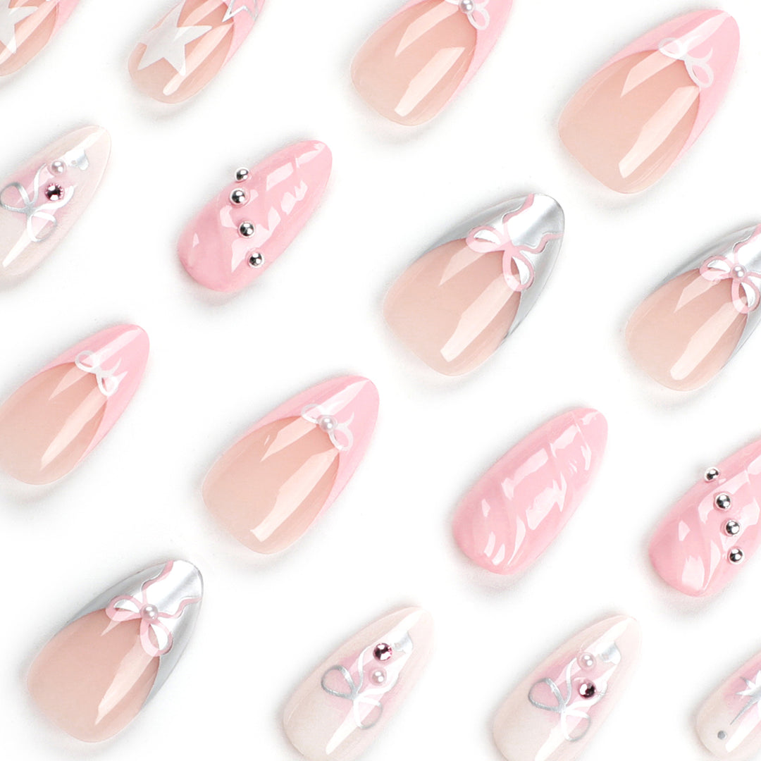 Artistic Nail Art with decorative bows and glitter accents Bowlift
