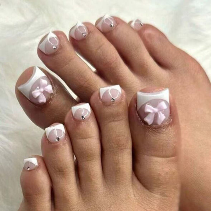 Nail art set with elegant French design and romantic bows Bowlift
