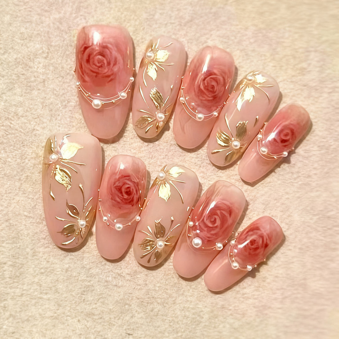 Artificial nail set with glamorous floral designs and creative glitter accents Bowlift