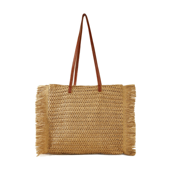Beach bag made of raffia with fringed details Bowlift