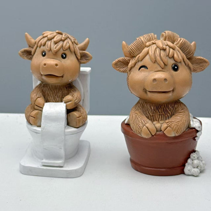 Funny decorative figure of a Highland cow on toilet Bowlift