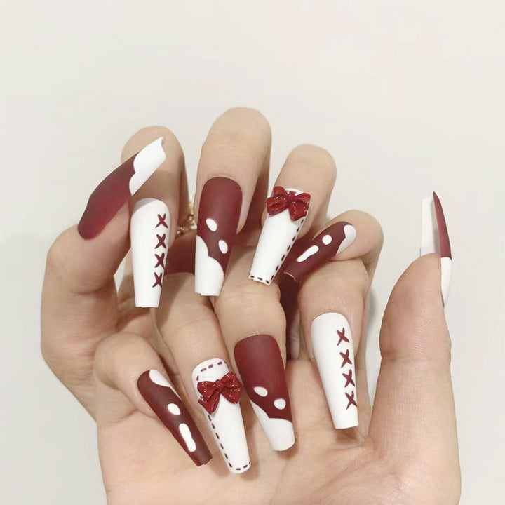 Artful stiletto nails with decoration and glitter Bowlift