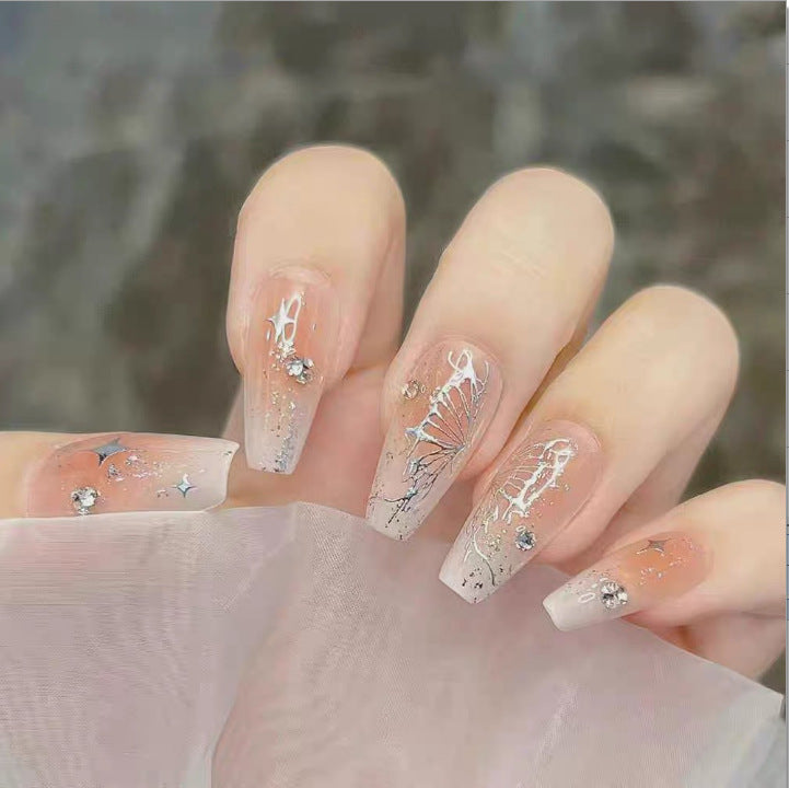 Artistic Nail Art with Glitter and Flower Applications Bowlift