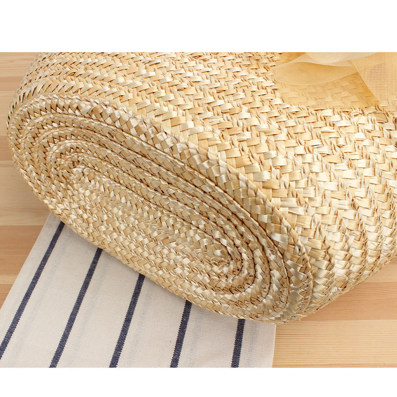 Elegant straw bag with floral accents Bowlift