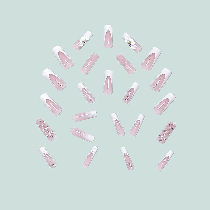 Artful stiletto nails with floral accents and rhinestone details Bowlift