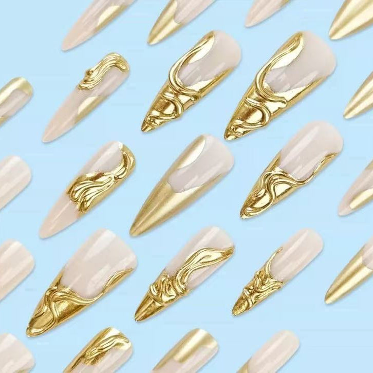 Artificial nails with golden, curved accents Bowlift
