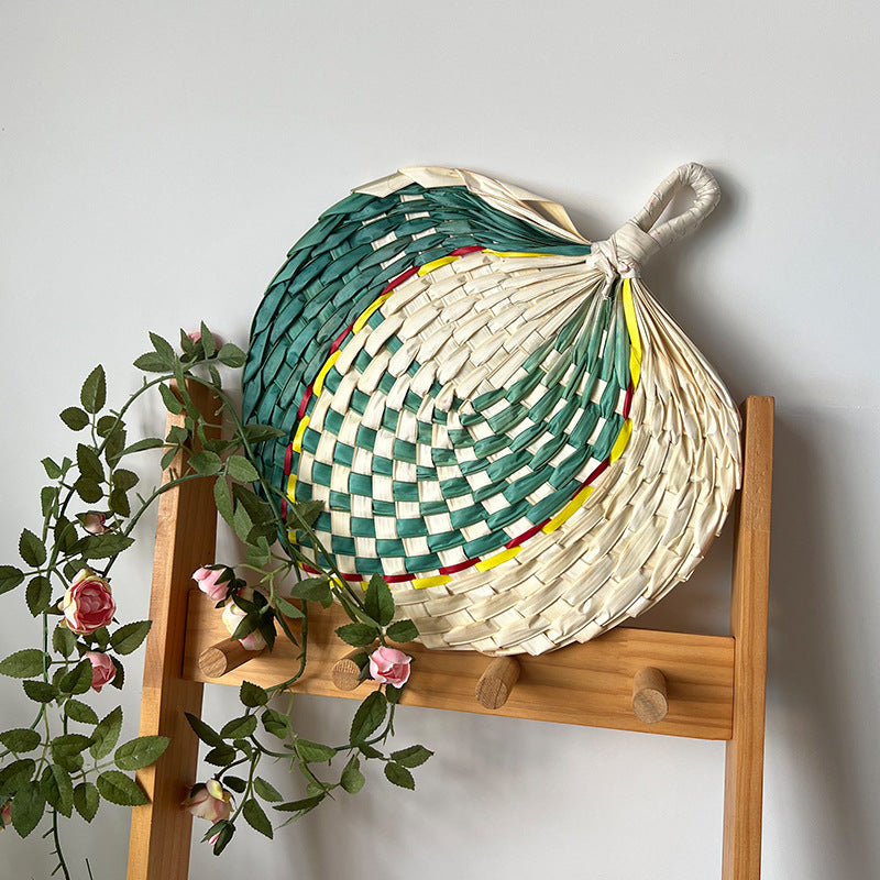 Women hand-woven fan made of natural material Bowlift